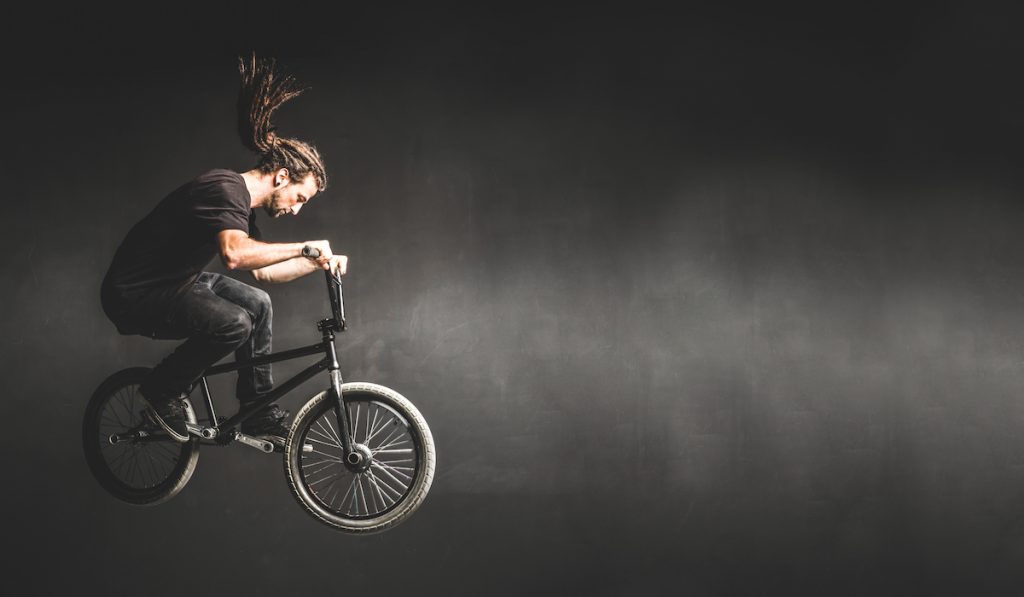 young lad jumping with bmx