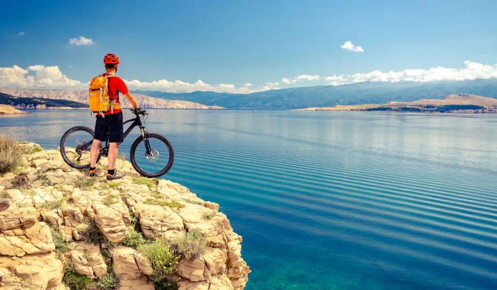 mountain biker with a lake view