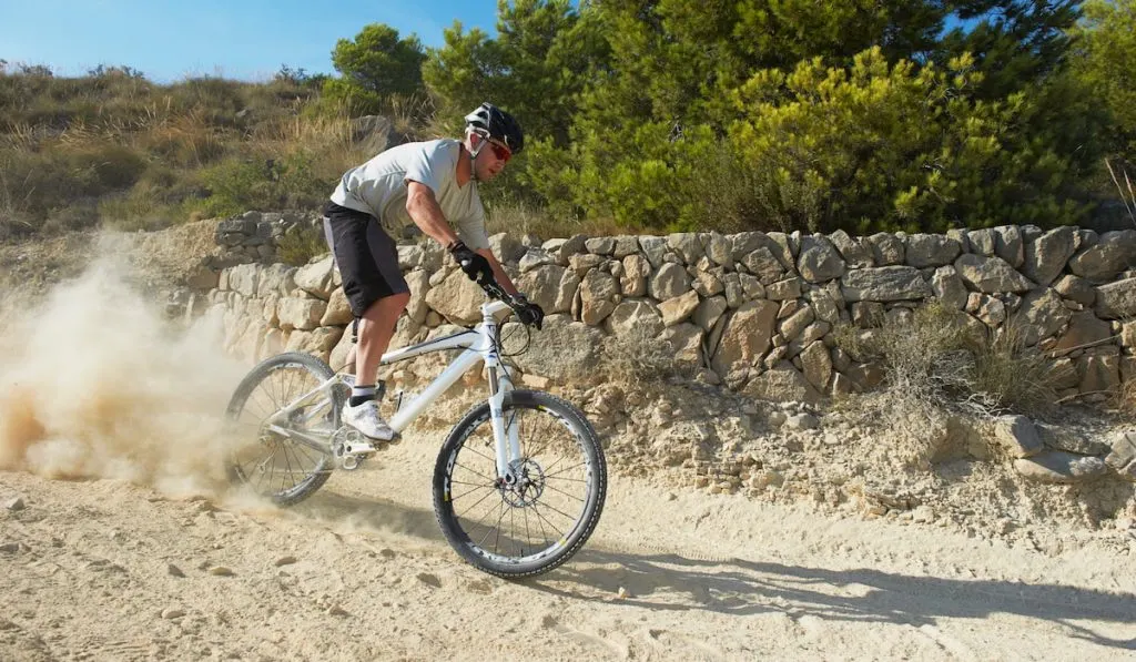 mountain biking down a trail