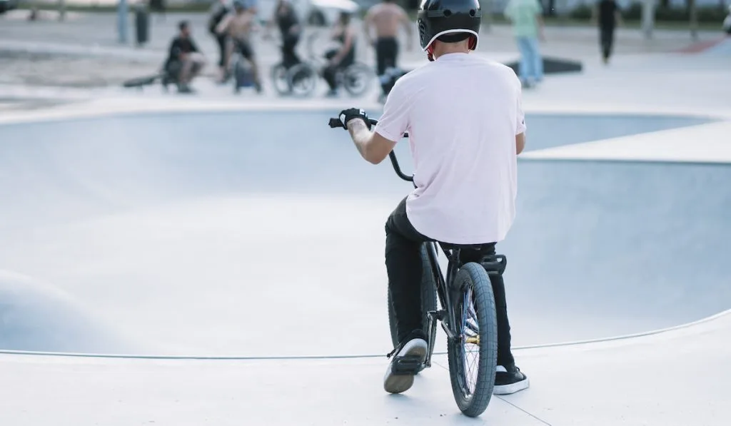 BMX Rider In Skatepark training outdoor
