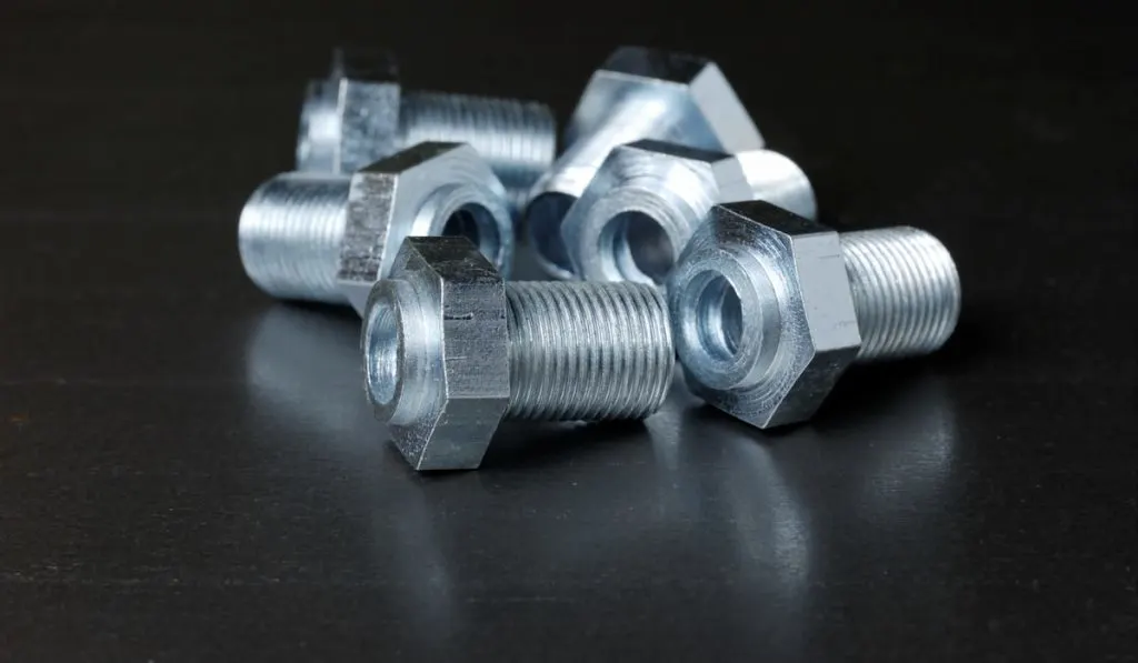 Close-up of several stainless steel bolts