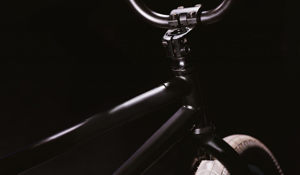 close-up view of bmx bicycle frame isolated on black background