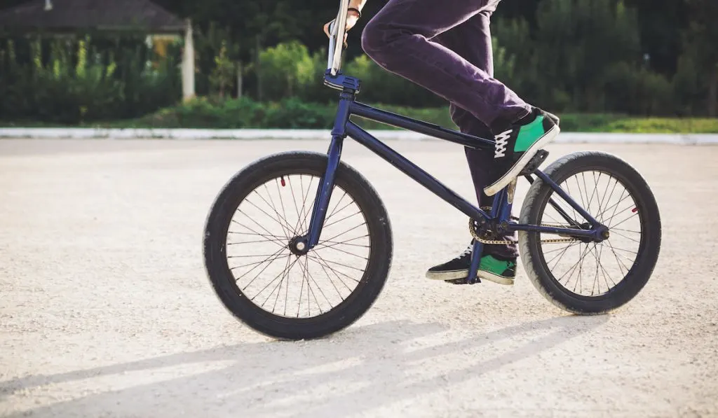 cropped photo of bmx rider riding his bicycle